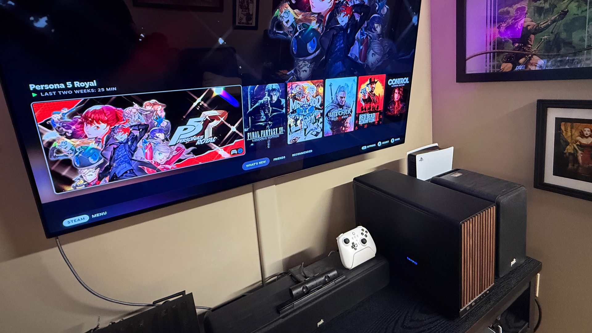 Photo of the Steam Deck next to the PC build