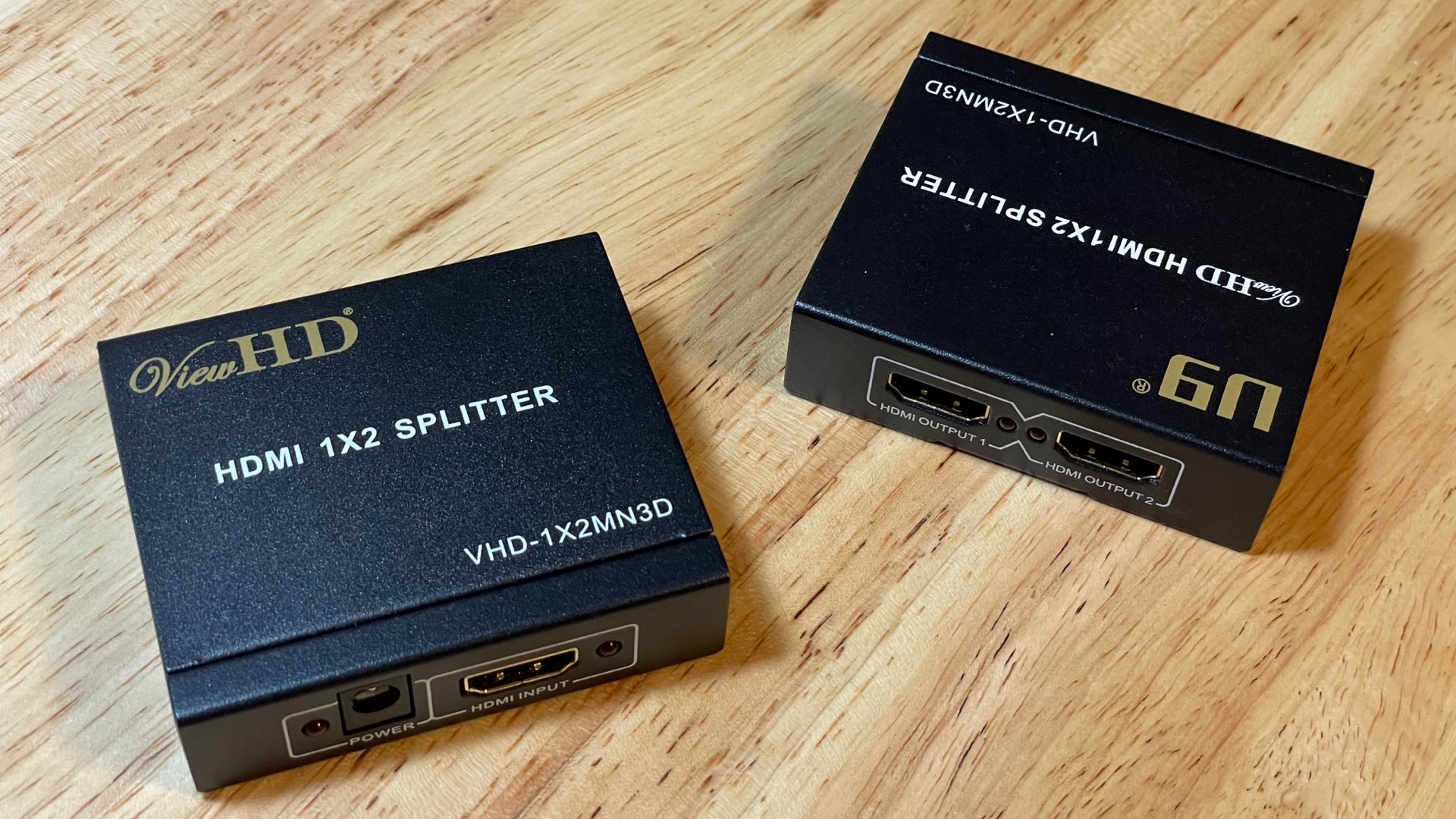 Photo of splitters that strip HDCP