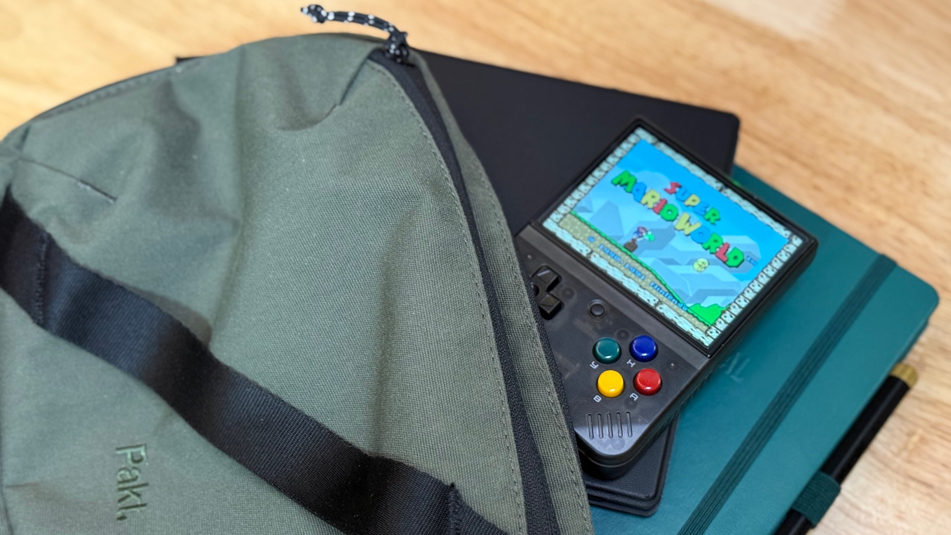 The Miyoo mini in an over the shoulder bag