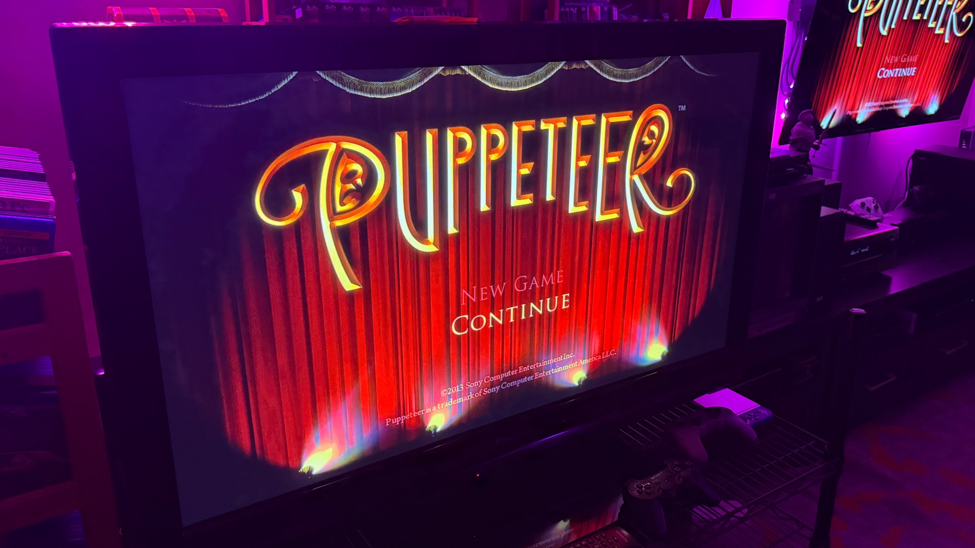 Photo of TV with the game Puppeteer